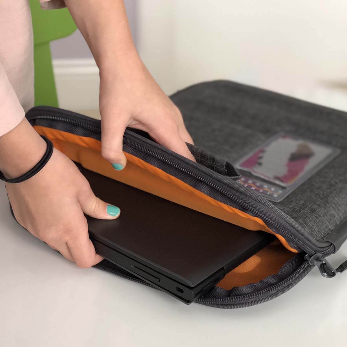 student using higher ground capsule laptop sleeve
