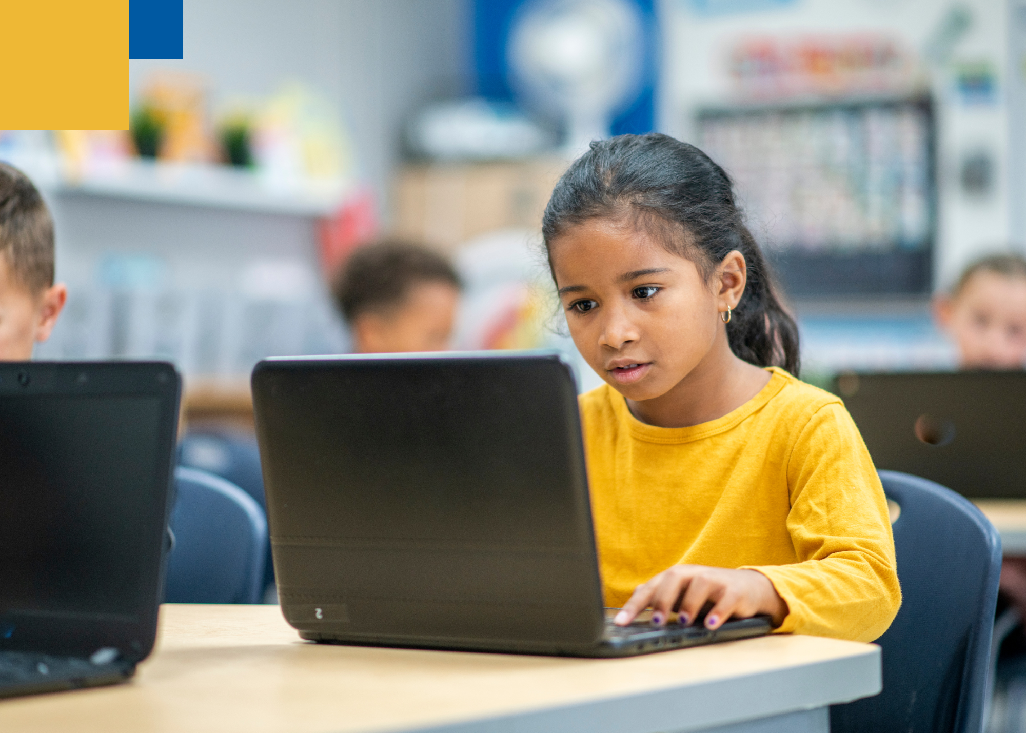 little girl completing task on school laptop