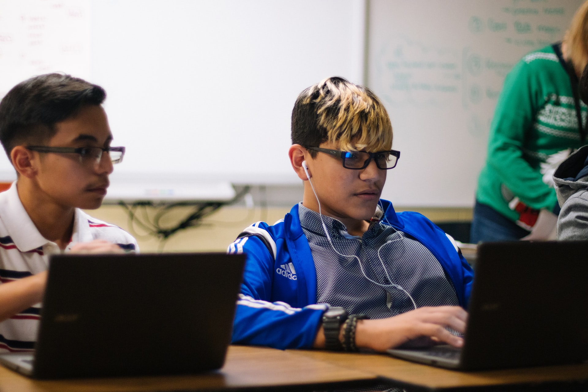 kids at school using laptop