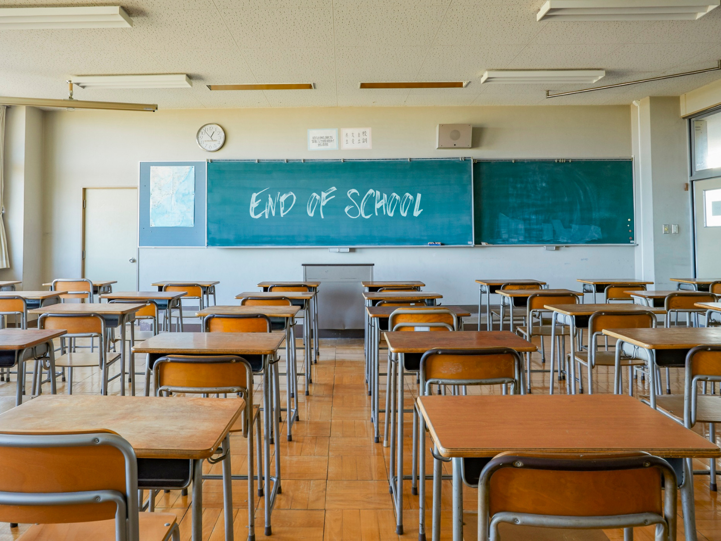 end of school written on classroom blackboard